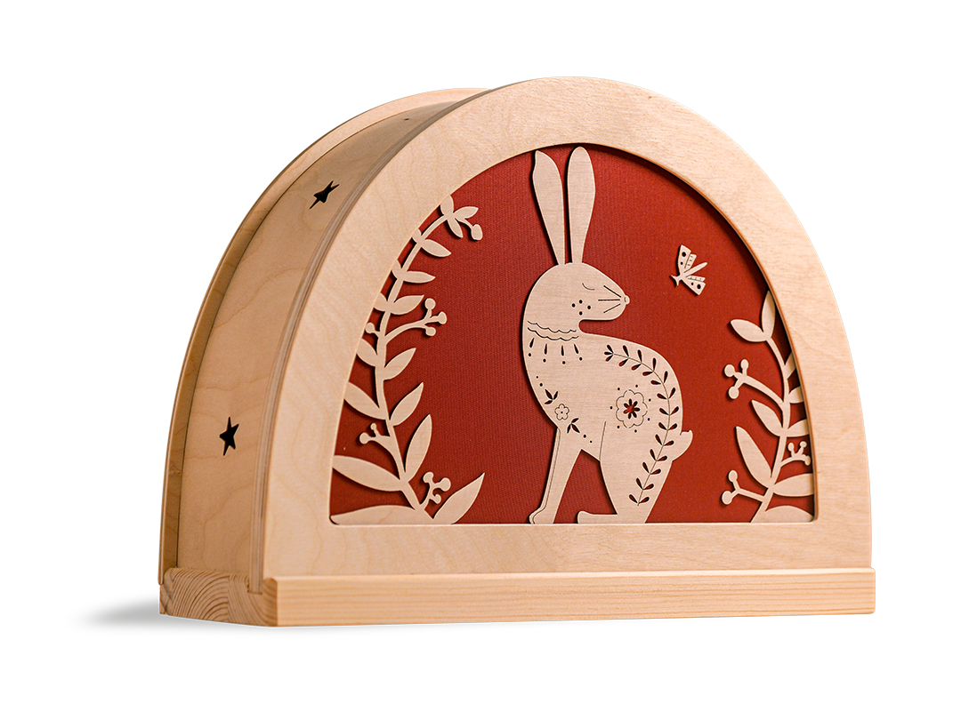 Folklore konijn silhouet in houten silhouetlamp met warm oranje licht